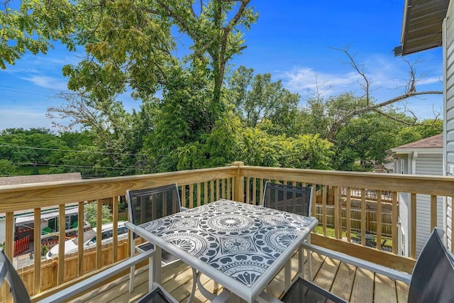 302 W College St, Branson, MO 65616 - wooden deck with outdoor dining area