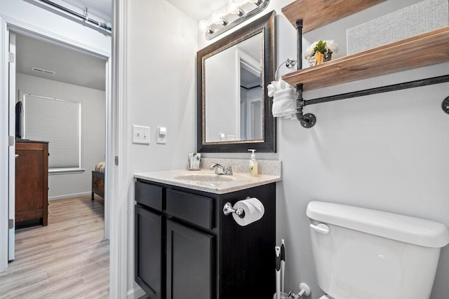 302 W College St, Branson, MO 65616 - bathroom featuring vanity and wood finished floors
