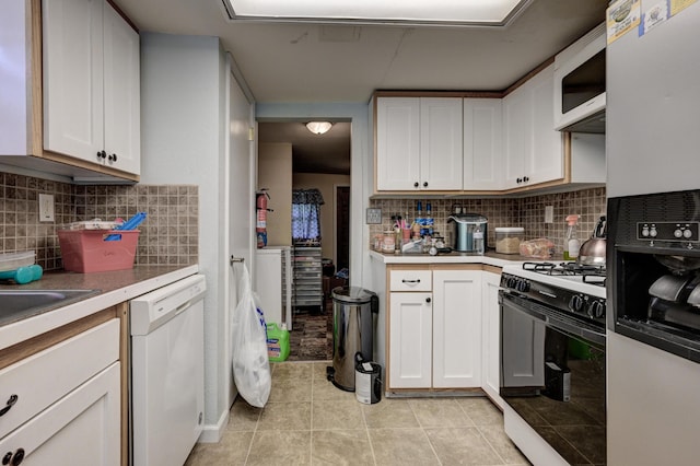 1027 S Orner St, Carthage, MO 64836 - kitchen featuring white appliances, light tile patterned flooring, backsplash, and white cabinetry