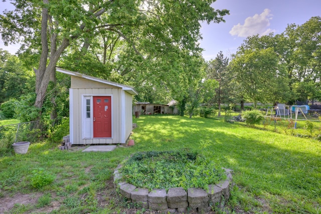 1027 S Orner St, Carthage, MO 64836 - fenced backyard with a storage unit