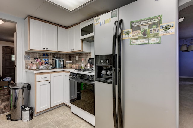 1027 S Orner St, Carthage, MO 64836 - kitchen featuring refrigerator with ice dispenser, gas range oven, white microwave, light countertops, and decorative backsplash