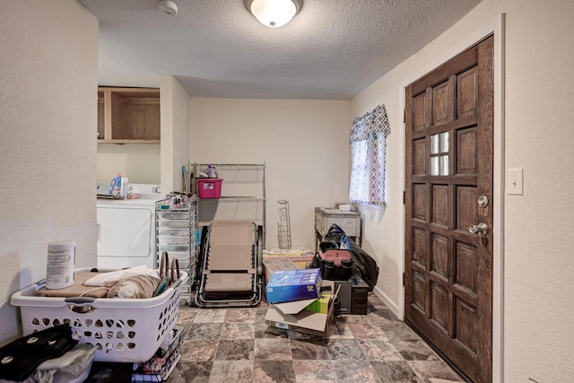 1027 S Orner St, Carthage, MO 64836 - washroom with cabinet space, a textured ceiling, washer and dryer, and stone finish flooring