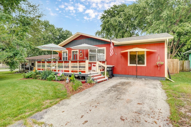 1648 N Yates Ave, Springfield, MO 65803 - view of front of property featuring a wooden deck and roof with shingles