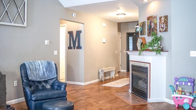 921 Woodhurst Dr, Marshfield, MO 65706 - living area with wood finished floors and a tile fireplace