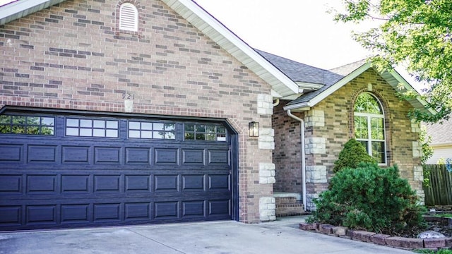 921 Woodhurst Dr, Marshfield, MO 65706 - view of front of home with concrete driveway, an attached garage, and brick siding