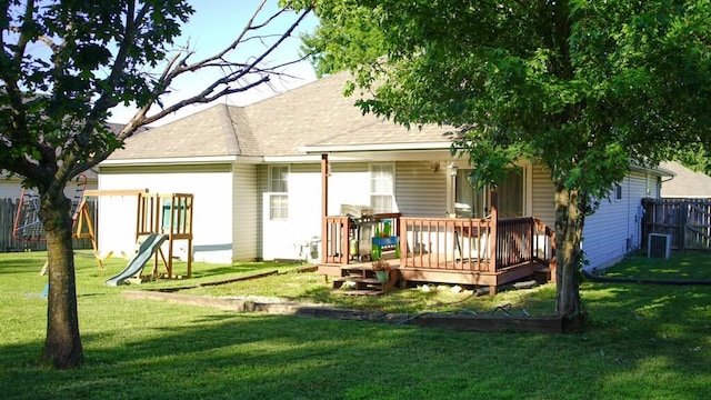 921 Woodhurst Dr, Marshfield, MO 65706 - rear view of house featuring a playground, a deck, and a shingled roof