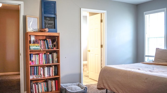 921 Woodhurst Dr, Marshfield, MO 65706 - tiled bedroom with multiple windows and ensuite bathroom
