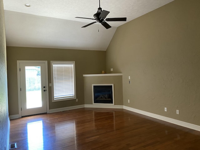 2114 E Finch St, Ozark, MO 65721 - unfurnished living room with wood finished floors, lofted ceiling, a glass covered fireplace, a ceiling fan, and a textured wall