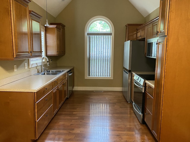2114 E Finch St, Ozark, MO 65721 - kitchen featuring appliances with stainless steel finishes, lofted ceiling, dark wood-style flooring, light countertops, and brown cabinetry