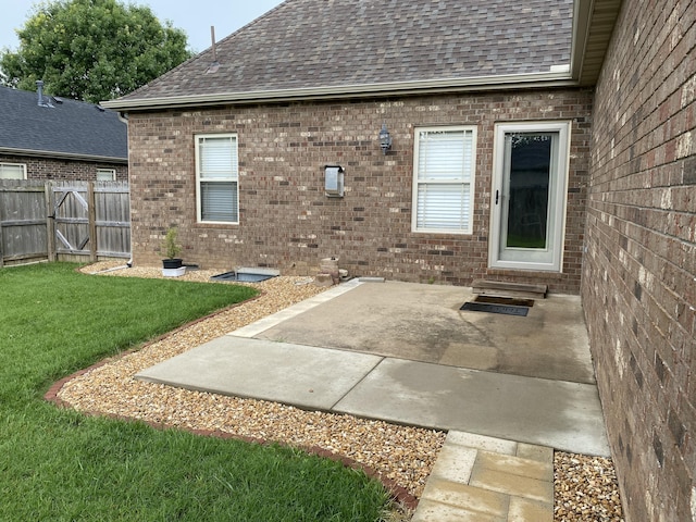 2114 E Finch St, Ozark, MO 65721 - back of house with roof with shingles, brick siding, a patio area, and entry steps