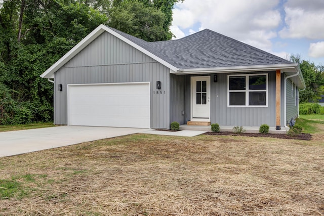 1851 N Patterson Ave, Springfield, MO 65803 - ranch-style house featuring roof with shingles, a garage, concrete driveway, and a front lawn
