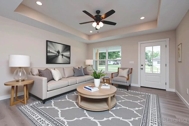 1851 N Patterson Ave, Springfield, MO 65803 - living room featuring a raised ceiling, wood finished floors, ceiling fan, and recessed lighting