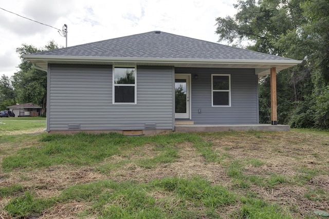 1851 N Patterson Ave, Springfield, MO 65803 - rear view of property with roof with shingles and a lawn