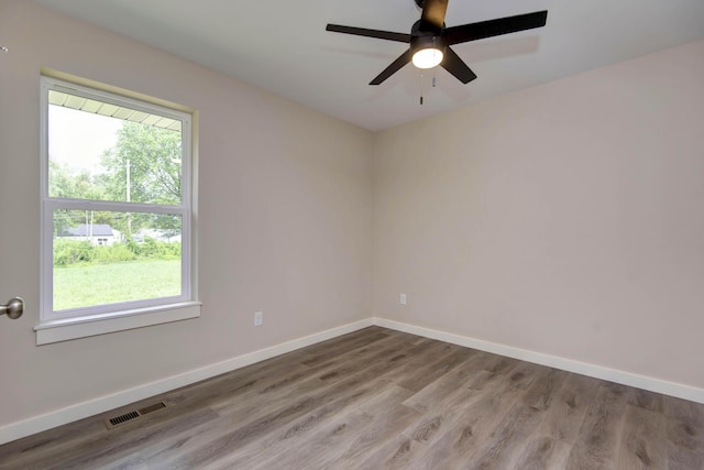 1851 N Patterson Ave, Springfield, MO 65803 - unfurnished room featuring wood finished floors and ceiling fan
