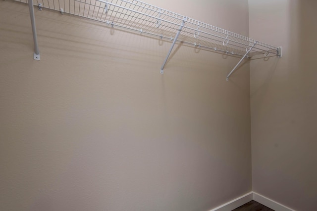 1851 N Patterson Ave, Springfield, MO 65803 - spacious closet with dark wood-style flooring