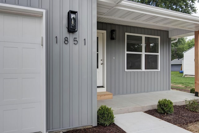 1851 N Patterson Ave, Springfield, MO 65803 - property entrance with a porch and board and batten siding