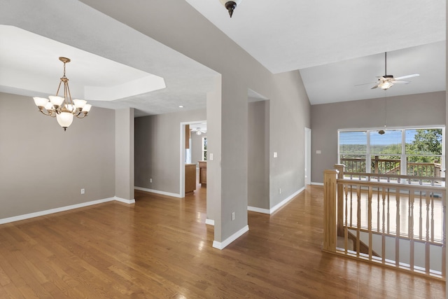 169 Tanner Rd, Branson, MO 65616 - spare room with a chandelier, ceiling fan, wood finished floors, and high vaulted ceiling