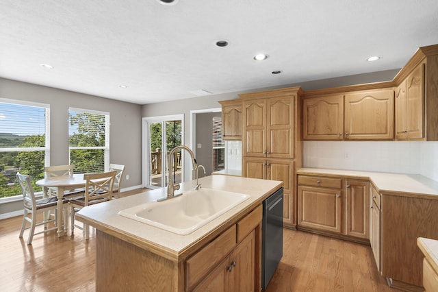 169 Tanner Rd, Branson, MO 65616 - kitchen featuring dishwashing machine, light wood-style floors, light countertops, recessed lighting, and a center island with sink