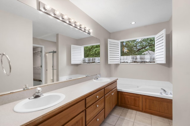 169 Tanner Rd, Branson, MO 65616 - full bathroom with a bath, tile patterned floors, a walk in closet, and double vanity