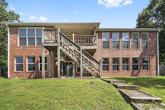169 Tanner Rd, Branson, MO 65616 - rear view of house featuring stairs, a lawn, brick siding, and a wooden deck
