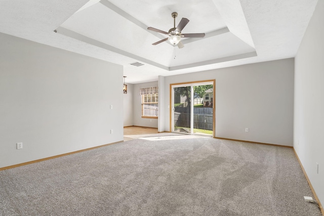 421 W White Ash Rd, Nixa, MO 65714 - empty room with a raised ceiling, ceiling fan, and carpet floors