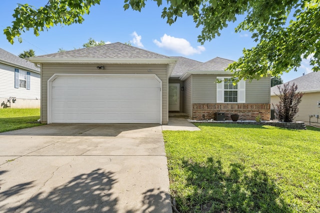 421 W White Ash Rd, Nixa, MO 65714 - ranch-style home with brick siding, a front yard, concrete driveway, and a garage