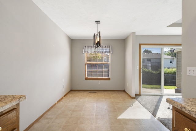 421 W White Ash Rd, Nixa, MO 65714 - unfurnished dining area with a chandelier and light flooring