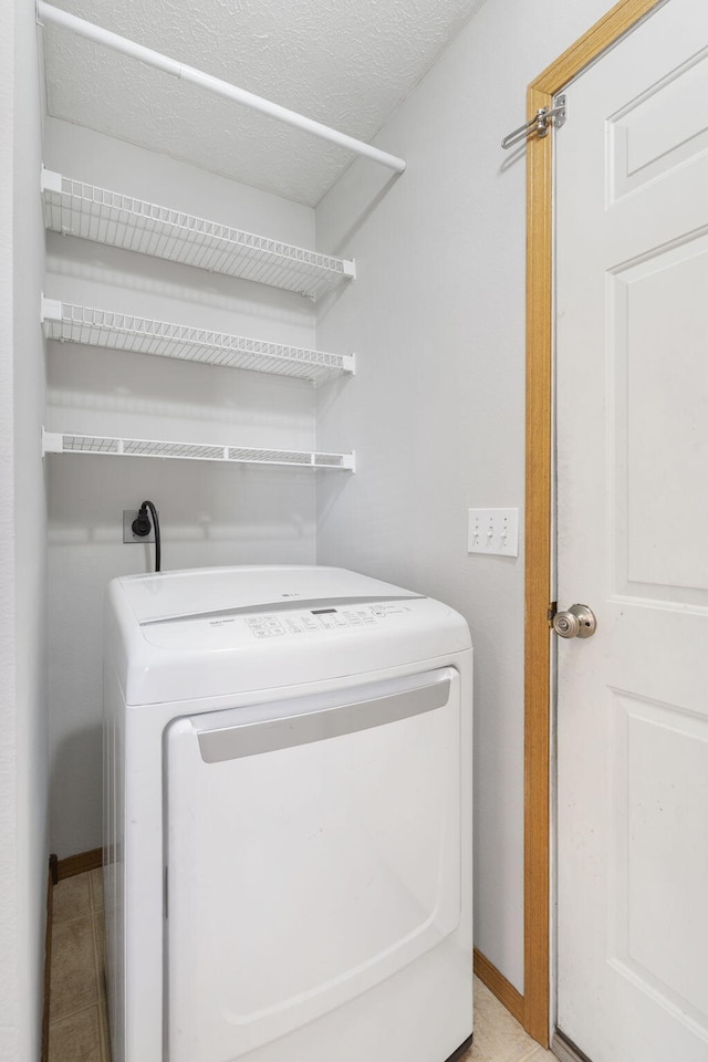 421 W White Ash Rd, Nixa, MO 65714 - laundry area featuring washer / clothes dryer and baseboards