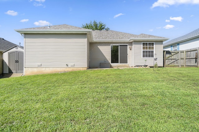421 W White Ash Rd, Nixa, MO 65714 - back of house with a storage shed, entry steps, a gate, and a shingled roof