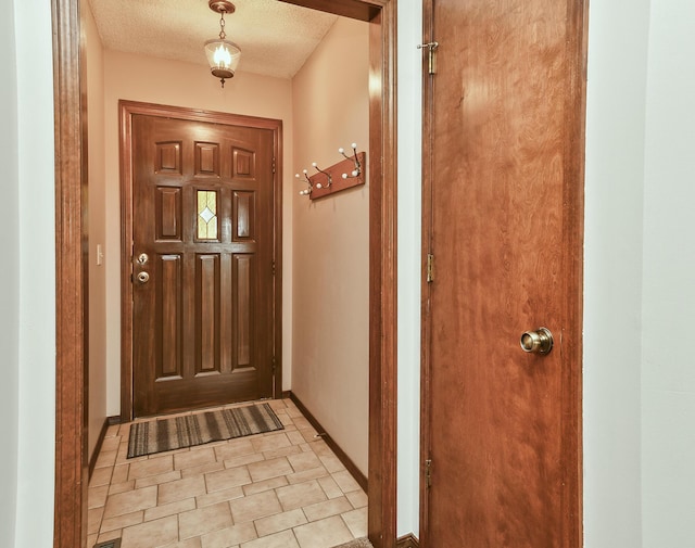 3642 N Olive Ct, Springfield, MO 65803 - doorway to outside with baseboards and a textured ceiling