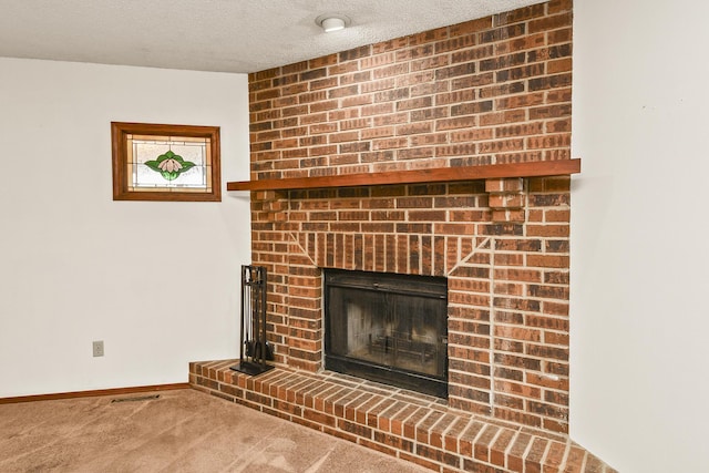 3642 N Olive Ct, Springfield, MO 65803 - detailed view of carpet, a fireplace, and a textured ceiling