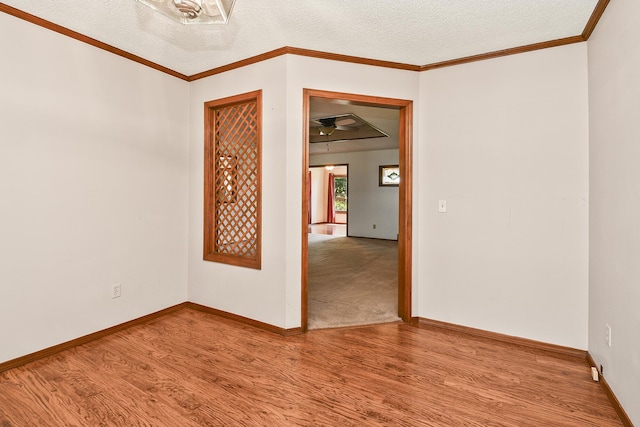 3642 N Olive Ct, Springfield, MO 65803 - unfurnished room with wood finished floors, a textured ceiling, and ceiling fan