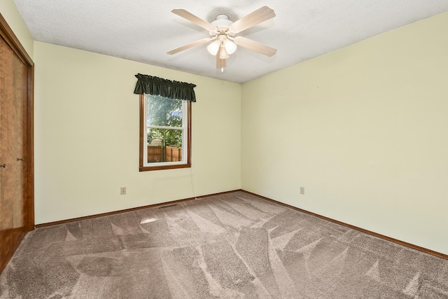 3642 N Olive Ct, Springfield, MO 65803 - unfurnished bedroom featuring carpet flooring, a closet, a textured ceiling, and a ceiling fan