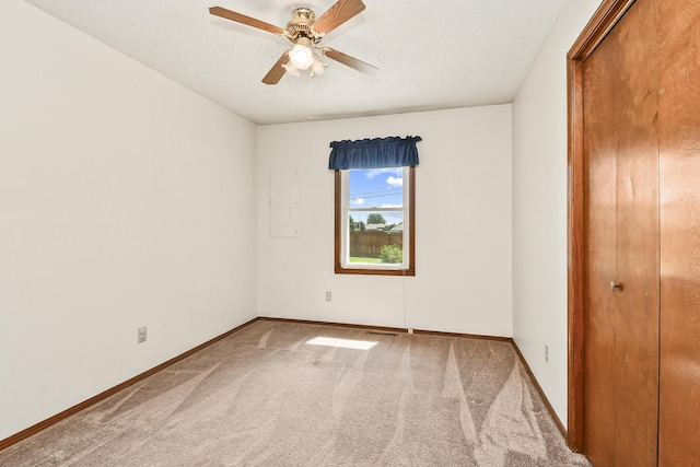 3642 N Olive Ct, Springfield, MO 65803 - unfurnished bedroom featuring carpet flooring, a closet, electric panel, and a ceiling fan