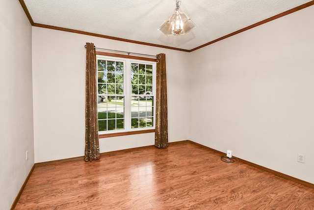 3642 N Olive Ct, Springfield, MO 65803 - unfurnished room with wood finished floors, a textured ceiling, and ornamental molding