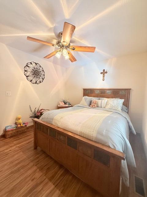 3086 S Suburban Ave, Springfield, MO 65807 - bedroom with wood finished floors and ceiling fan