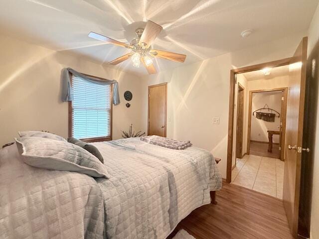 3086 S Suburban Ave, Springfield, MO 65807 - bedroom with a ceiling fan and light wood-style floors