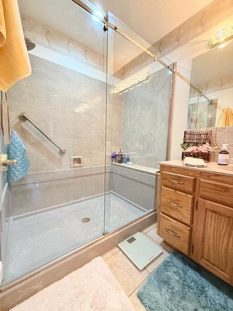 3086 S Suburban Ave, Springfield, MO 65807 - full bathroom featuring a shower stall, vanity, and tile patterned floors