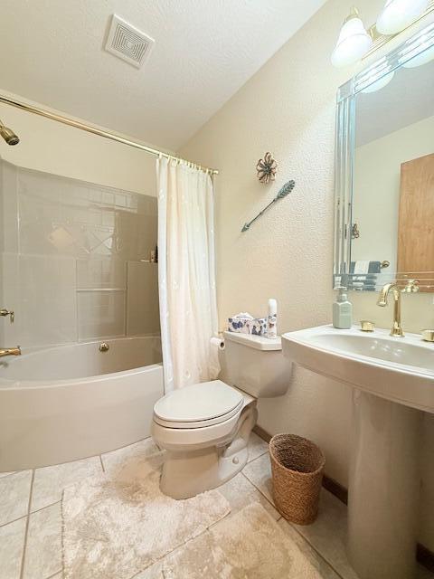 3086 S Suburban Ave, Springfield, MO 65807 - bathroom with shower / bathtub combination with curtain and tile patterned flooring