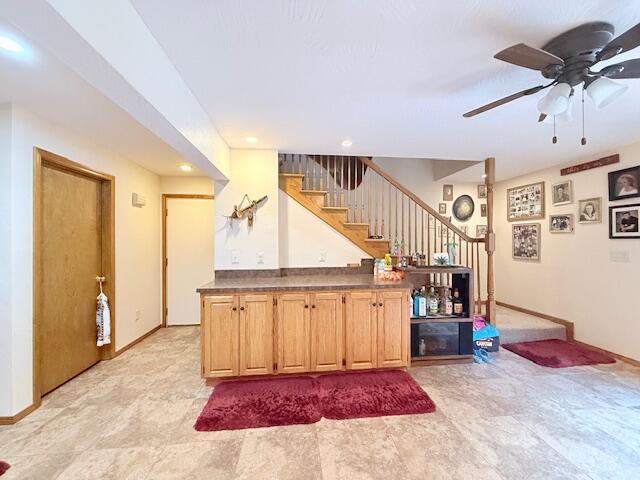 3086 S Suburban Ave, Springfield, MO 65807 - indoor dry bar with stairs, a ceiling fan, and recessed lighting