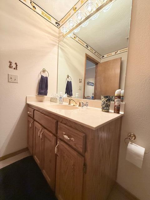 3086 S Suburban Ave, Springfield, MO 65807 - bathroom featuring vanity and baseboards