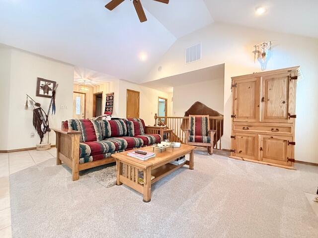 3086 S Suburban Ave, Springfield, MO 65807 - living area featuring vaulted ceiling, ceiling fan, and light carpet