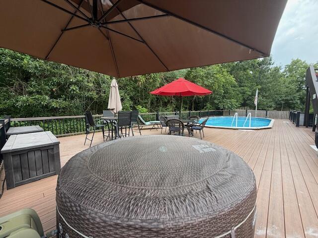 3086 S Suburban Ave, Springfield, MO 65807 - wooden deck with outdoor dining area