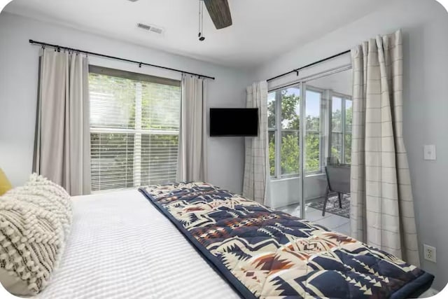 200 Golfview Dr Unit D5, Branson, MO 65616 - bedroom featuring multiple windows and ceiling fan