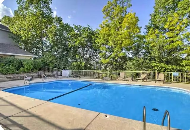 200 Golfview Dr Unit D5, Branson, MO 65616 - community pool with view of scattered trees and a patio
