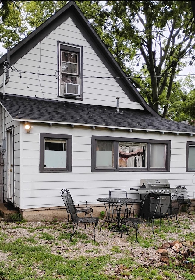 1885 N Lyon Ave, Springfield, MO 65803 - back of house featuring a shingled roof and cooling unit