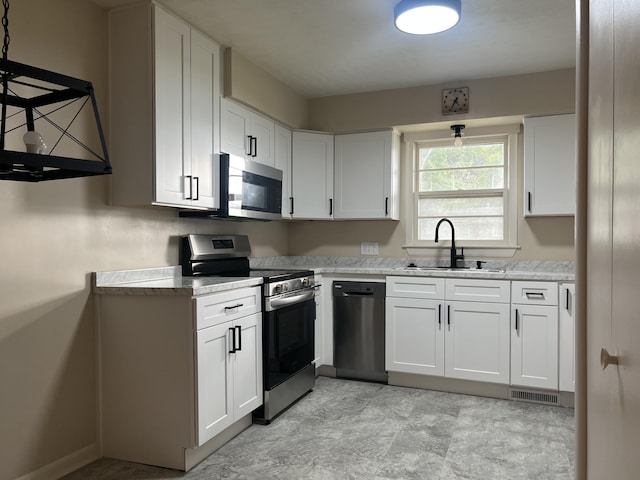 1846 S Nettleton Ave, Springfield, MO 65807 - kitchen featuring stainless steel appliances and white cabinets