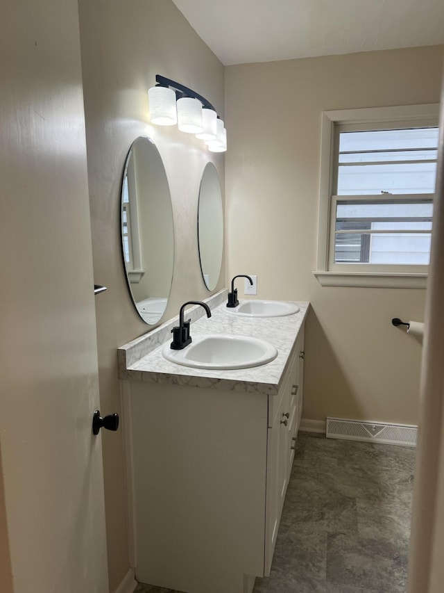 1846 S Nettleton Ave, Springfield, MO 65807 - bathroom featuring double vanity and baseboards