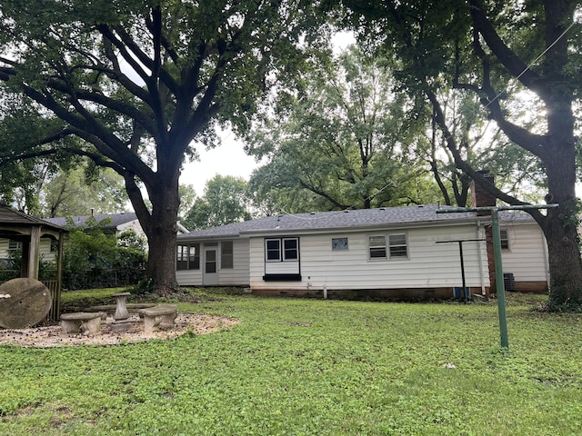 1846 S Nettleton Ave, Springfield, MO 65807 - rear view of property featuring a yard and a shingled roof
