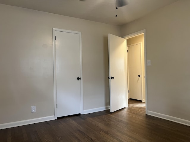 1846 S Nettleton Ave, Springfield, MO 65807 - unfurnished bedroom with dark wood-type flooring and baseboards
